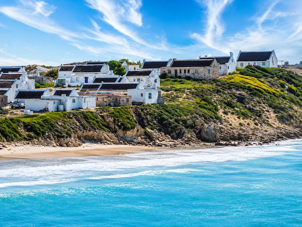 Coastal Cottages Above Turquoise Waves